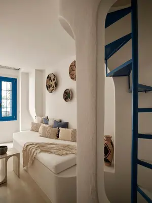 a bedroom with a bed and a loft bed with a ladder at Athens Cycladic Hideaway in Athens