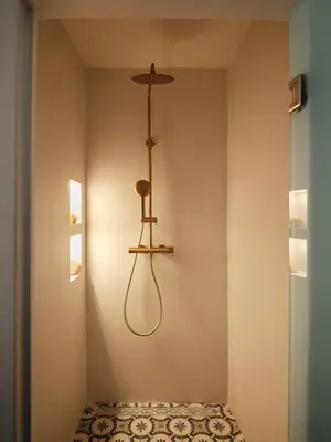 a room with a light fixture on the wall at Athens Cycladic Hideaway in Athens