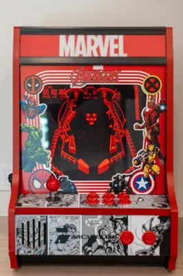 a marvellous marvel memory box with a spider man and other toys at 1BR Next to Metro Modern Living & Arcade Machine in Athens