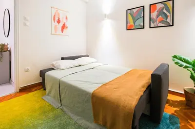 a bedroom with a bed in a room at Athens Retreat Paleo Faliro,Onassis,REA Hospital in Athens