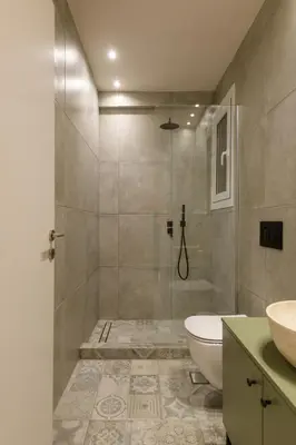 a bathroom with a shower and a toilet and a sink at Nea Smyrni Square Appartment in Athens