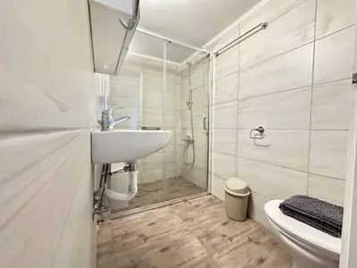 a bathroom with a shower and a sink and a toilet at Votanikos Urban Nook, Athens in Athens