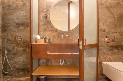 a bathroom with a sink and a mirror at Koukaki Cityscape in Athens