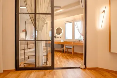 a large mirror in a room with a desk at Koukaki Cityscape in Athens