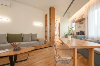 a living room with a table and a couch at Koukaki Cityscape in Athens