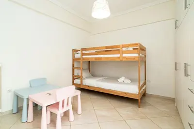 a room with a bunk bed and a table and a desk at Azotea Con Vista Athens in Athens
