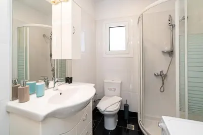 a bathroom with a sink and a toilet and a shower at Azotea Con Vista Athens in Athens