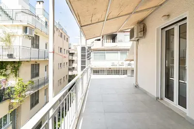 an empty balcony of a building with buildings at Altezza Terrazza Athens in Athens