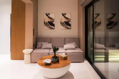 a living room with a couch and a table at Aura Vista Acropolis view in Athens