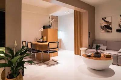 a living room with a table and a couch at Aura Vista Acropolis view in Athens