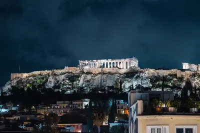 a building sitting on top of a mountain at Aura Vista Acropolis view in Athens