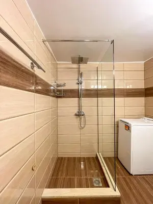 a shower with a glass door in a bathroom at Belita large 1BR close to the Acropolis in Athens