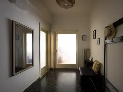 a living room with a large mirror and a window at Belita large 1BR close to the Acropolis in Athens