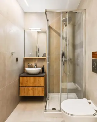 a bathroom with a shower and a sink and a toilet at Limehome Piraeus Iris in Piraeus