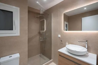 a bathroom with a sink and a shower at Acropolis Retreat Walk to Museum in Athens
