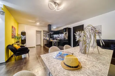 a dining room with a table with a hat on it at Two bedroom Lux apartment Next to the metro in Athens