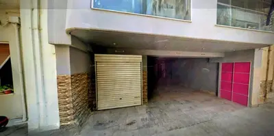 a garage with two doors in a building at Two bedroom Lux apartment Next to the metro in Athens