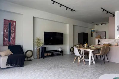 a living room with a table and a dining room at Acropolis Panorama Luxury Loft 8th fl Balcony View in Athens