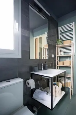 a bathroom with a sink and a mirror and a toilet at Acropolis Panorama Luxury Loft 8th fl Balcony View in Athens