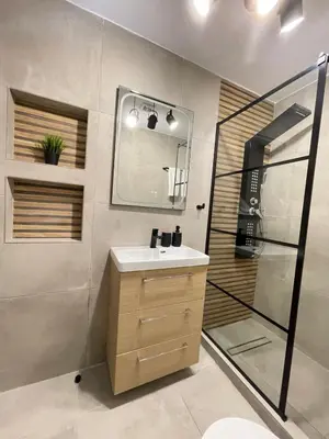 a bathroom with a sink and a shower with a mirror at Athens Praxitelous Vibes & Nest in Athens