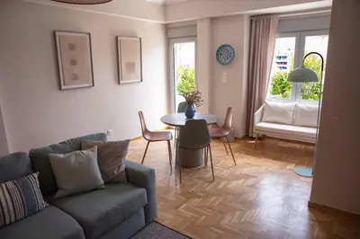 a living room with a couch and a table at Contemporary Athenian Escape GHH in Athens