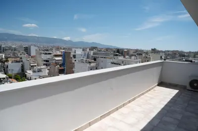 a balcony with a view of a city at Top-Floor Retreat in Piraeus-H5 in Piraeus