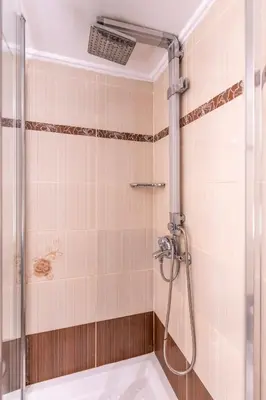 a bathroom with a shower with a tub at Stylish 2BDR Exarchia Apt with Balcony and Workspace in Athens