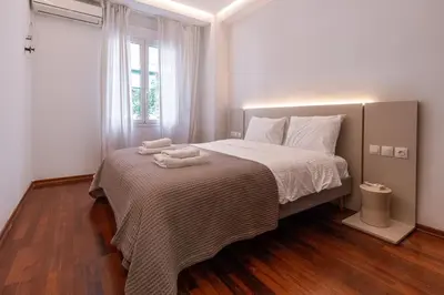 a bedroom with a bed with two towels on it at Stylish 2BDR Exarchia Apt with Balcony and Workspace in Athens