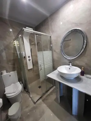 a bathroom with a toilet and a sink and a mirror at Diamond Piraeus Port in Piraeus