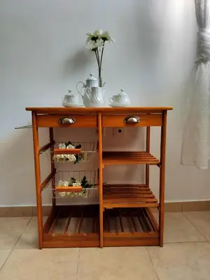 a wooden cabinet with a vase on top of it at Charming Flat in Central Athens in Athens