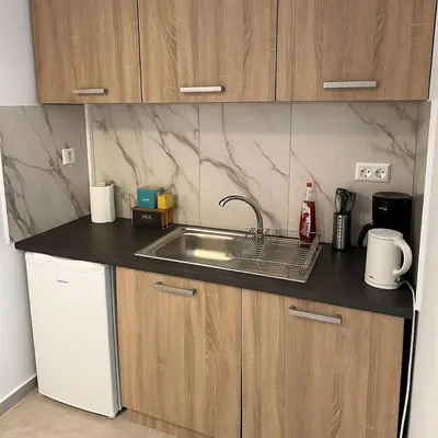a kitchen with a sink and a counter top at Athenian Stay 601 Apartment in Athens