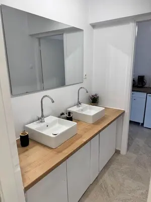 a bathroom with two sinks and a mirror at Athenian Stay 605 Apartment in Athens