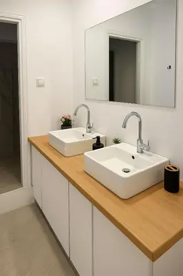 a bathroom counter with two sinks and a mirror at Athenian Stay 605 Apartment in Athens