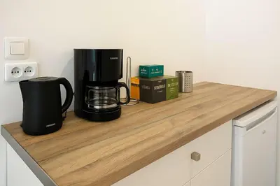 a coffee maker sitting on a wooden counter top at Athenian Stay 605 Apartment in Athens