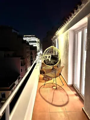 a balcony with a bench on top of a building at Athenian Stay 606 Apartment in Athens