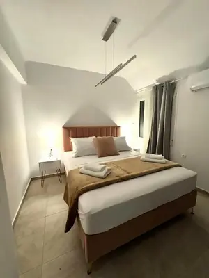 a bedroom with a large bed in a room at Athenian Stay 606 Apartment in Athens