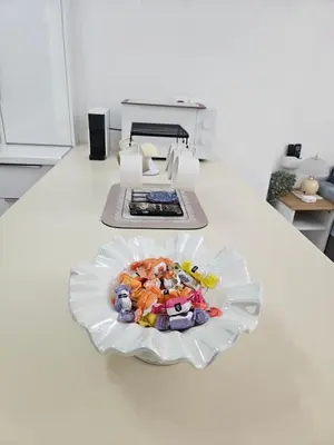 a plate of toys on a counter in a kitchen at Acropolis Dream Apartment - 50sqm 2BR Big Living Room with Large Terrace Next to Siggrou FIX Subway Station in the City Center in Athens