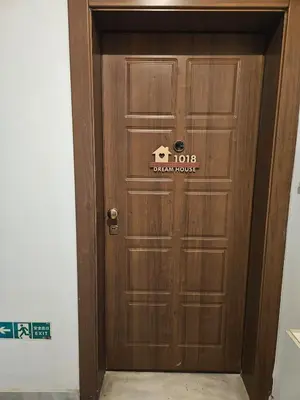 a wooden door with a hotel sign on it at Acropolis Dream Apartment - 50sqm 2BR Big Living Room with Large Terrace Next to Siggrou FIX Subway Station in the City Center in Athens