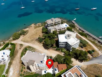 an aerial view of a house on an island in the water at Stef's Place Porto Rafti in Porto Rafti