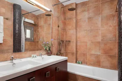 a bathroom with a sink and a tub at Aeolia Villa Athenian Riviera in Anavissos