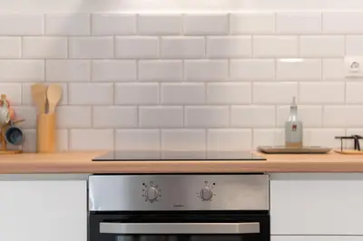 a stove top oven in a kitchen next to a counter at 2BR Modern Comfort Top Location in Athens