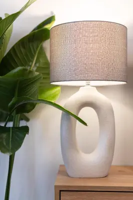 a white vase with a lamp on a table at 2BR Modern Comfort Top Location in Athens