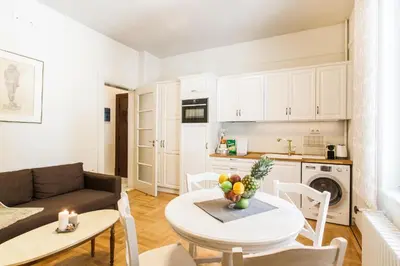 a living room with a couch and a table with fruit on it at Restored Historic APT in Plaka,Under the Acropolis in Athens