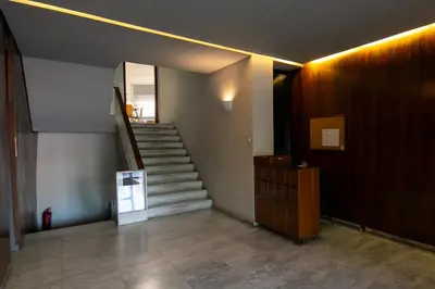 a hallway with a staircase in a building at Comfy 2BR Flat in Central Athens in Athens