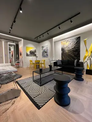 a living room with furniture and paintings on the walls at Art Gallery Apartment in Athens