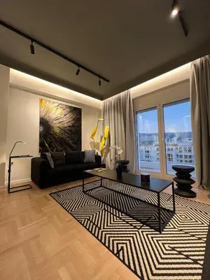 a living room with a couch and a rug at Art Gallery Apartment in Athens