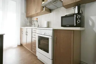 a kitchen with a microwave and a stove at Velora Apartments in Athens