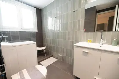 a bathroom with a sink and a toilet at 5th floor Apt with Acropolis view in Pangrati in Athens
