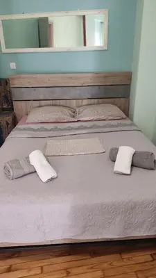 a bed with two pillows on top of it at Ασφαλές και σύγχρονο διαμέρισμα in Athens