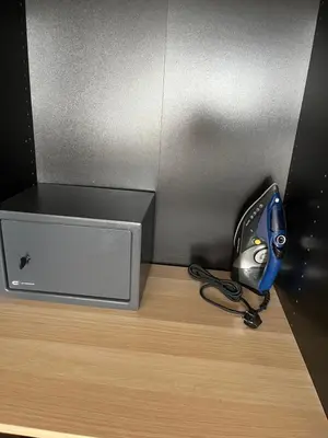 a desk with a phone next to a box at MARGARITAS' SUITES viktoria square in Athens